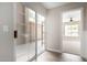 Hallway with sliding glass door to patio and view of backyard at 8773 W Pineveta Dr, Arizona City, AZ 85123