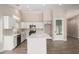 Modern kitchen with white cabinets, quartz countertops and stainless steel appliances at 8773 W Pineveta Dr, Arizona City, AZ 85123