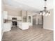 Open kitchen features white cabinets, stainless steel appliances, and an island at 8773 W Pineveta Dr, Arizona City, AZ 85123