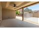 Covered patio with ceiling fan, overlooking the backyard pool and gazebo at 8773 W Pineveta Dr, Arizona City, AZ 85123