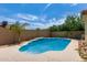 Sparkling blue pool with a built-in tanning ledge at 8773 W Pineveta Dr, Arizona City, AZ 85123