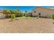 Large backyard with gravel, grass and a seating area at 9555 W Escuda Dr, Peoria, AZ 85382