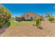 Landscaped backyard with patio and home exterior view at 9555 W Escuda Dr, Peoria, AZ 85382