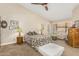 Main bedroom with plush carpeting and a ceiling fan at 9555 W Escuda Dr, Peoria, AZ 85382