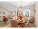 Bright dining room featuring a wood table and chairs, and a chandelier at 9555 W Escuda Dr, Peoria, AZ 85382