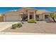 Light beige house with tile roof, two-car garage, and drought-tolerant landscaping at 9555 W Escuda Dr, Peoria, AZ 85382