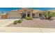 One-story home with a two-car garage and nicely landscaped yard at 9555 W Escuda Dr, Peoria, AZ 85382