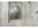 Walk-in shower with glass enclosure and pebble floor at 9555 W Escuda Dr, Peoria, AZ 85382