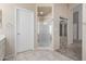 Bathroom features a shower, a large mirror, and a walk-in closet at 968 S Western Skies Dr, Gilbert, AZ 85296