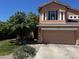 Two-story house with a two-car garage and mature landscaping at 968 S Western Skies Dr, Gilbert, AZ 85296