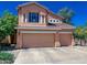 Charming two-story home featuring a three-car garage, a well-manicured front yard, and a classic design at 968 S Western Skies Dr, Gilbert, AZ 85296