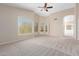 Bright and airy main bedroom with carpet and views from multiple windows at 968 S Western Skies Dr, Gilbert, AZ 85296