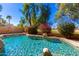 Inviting kidney-shaped pool surrounded by lush landscaping at 968 S Western Skies Dr, Gilbert, AZ 85296