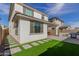 The backyard features a covered patio, outdoor kitchen, pavers, and artificial turf at 10029 E Tahoe Ave, Mesa, AZ 85212