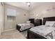 Shared bedroom featuring two beds with an Eiffel Tower motif and individual dark wood nightstands at 10029 E Tahoe Ave, Mesa, AZ 85212