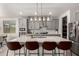 Modern eat-in kitchen with a large island, stainless steel appliances, and gray cabinets at 10029 E Tahoe Ave, Mesa, AZ 85212