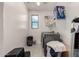 The laundry room features a window providing natural light, newer washer and dryer, and ample storage at 10029 E Tahoe Ave, Mesa, AZ 85212