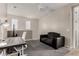 Living room with a comfortable sofa and a ceiling fan, perfect for relaxation and entertainment at 10029 E Tahoe Ave, Mesa, AZ 85212