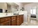 Elegant bathroom with double sinks and a large mirror at 10196 E Legend Trl, Gold Canyon, AZ 85118