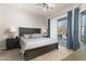 Spacious bedroom with plush carpet and access to balcony at 10196 E Legend Trl, Gold Canyon, AZ 85118