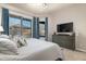 Bright bedroom featuring a large TV and mountain views at 10196 E Legend Trl, Gold Canyon, AZ 85118