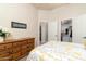 Bright bedroom with double bed, dresser, and walk-in closet at 10196 E Legend Trl, Gold Canyon, AZ 85118