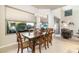 Bright dining room with large windows and wooden table at 10196 E Legend Trl, Gold Canyon, AZ 85118
