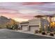 Two-car garage and front elevation with mountain backdrop at 10196 E Legend Trl, Gold Canyon, AZ 85118