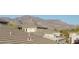 Mountain views and community of upscale homes with tile roofs at 10196 E Legend Trl, Gold Canyon, AZ 85118