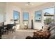 Open living room with multiple windows and access to balcony at 10196 E Legend Trl, Gold Canyon, AZ 85118