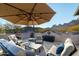 Relaxing rooftop patio with mountain views and comfortable seating at 10196 E Legend Trl, Gold Canyon, AZ 85118