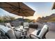 Spacious rooftop patio with mountain views and seating area at 10196 E Legend Trl, Gold Canyon, AZ 85118