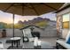 Relaxing rooftop patio boasts mountain views and comfortable seating at 10196 E Legend Trl, Gold Canyon, AZ 85118