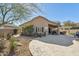 Landscaped backyard featuring a large patio at 10282 E Trailhead Ct, Gold Canyon, AZ 85118