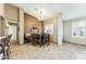 Cozy dining area with stylish light fixture, neutral walls, and lots of natural light at 10282 E Trailhead Ct, Gold Canyon, AZ 85118