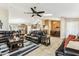 Spacious living room featuring tile floors, a ceiling fan, and seamless transition to dining area at 10282 E Trailhead Ct, Gold Canyon, AZ 85118