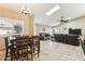 Inviting open-concept living space with tile flooring, a ceiling fan, and lots of natural light at 10282 E Trailhead Ct, Gold Canyon, AZ 85118