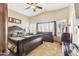 Relaxing primary bedroom with vaulted ceiling, ceiling fan, shuttered windows and neutral color palette at 10282 E Trailhead Ct, Gold Canyon, AZ 85118