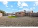 Backyard with patio, artificial turf, and fenced area at 10572 W Echo Ln, Peoria, AZ 85345