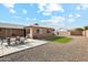 Backyard with patio, artificial turf, and seating area at 10572 W Echo Ln, Peoria, AZ 85345