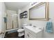Clean bathroom with white vanity and a shower/tub combo at 10572 W Echo Ln, Peoria, AZ 85345