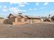 Tan one-story house with rock landscaping and a two-car garage at 10572 W Echo Ln, Peoria, AZ 85345