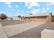 House exterior with a gravel driveway and desert landscaping at 10572 W Echo Ln, Peoria, AZ 85345