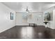 Living room with hardwood floors and white walls at 10572 W Echo Ln, Peoria, AZ 85345