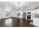 Open concept living room with kitchen and dining area at 10572 W Echo Ln, Peoria, AZ 85345