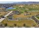 Aerial view of a luxury community with a golf course, pool, and modern homes at 11444 N Northfield St, Surprise, AZ 85388