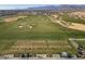 Aerial view of a golf course with players and golf carts at 11444 N Northfield St, Surprise, AZ 85388