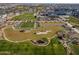 Aerial view of community amenities, including pools, landscaping, and clubhouse at 11444 N Northfield St, Surprise, AZ 85388