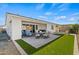 Large backyard with covered patio, artificial turf, and plenty of space for entertaining at 11444 N Northfield St, Surprise, AZ 85388