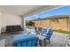 Relaxing backyard patio featuring comfortable seating and a view of the grassy area at 11444 N Northfield St, Surprise, AZ 85388